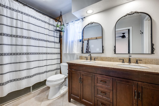 bathroom featuring vanity, tile patterned floors, toilet, and a shower with shower curtain