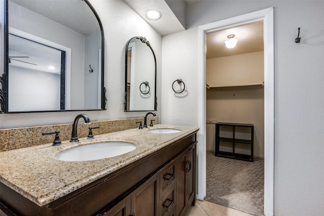 bathroom with tile patterned flooring and vanity