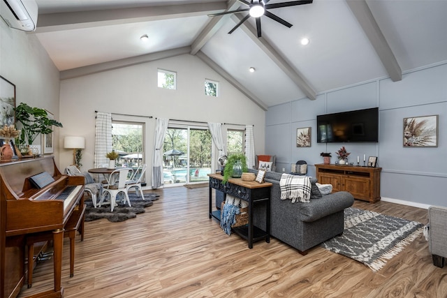 living room featuring high vaulted ceiling, a wall mounted air conditioner, beam ceiling, and light hardwood / wood-style flooring