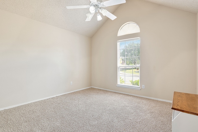 carpeted empty room with a textured ceiling, high vaulted ceiling, and ceiling fan