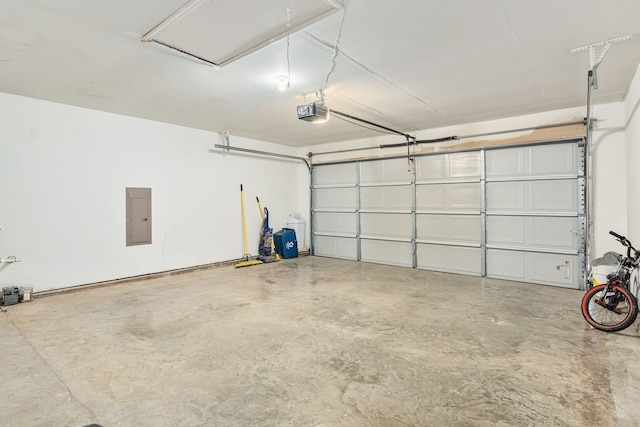 garage featuring a garage door opener and electric panel