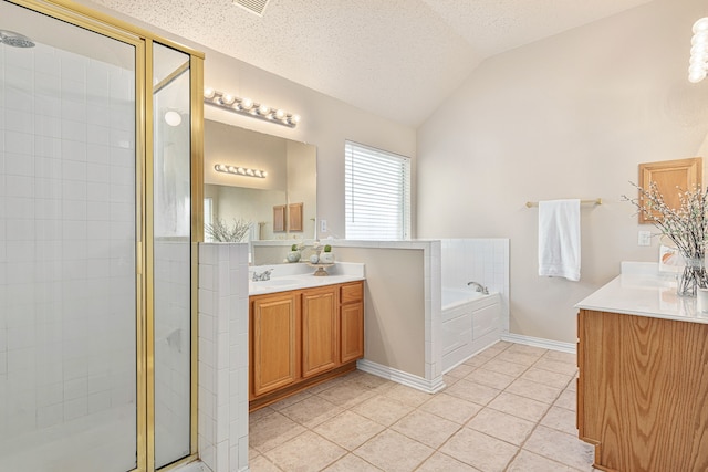 bathroom with vaulted ceiling, plus walk in shower, vanity, tile patterned floors, and a textured ceiling