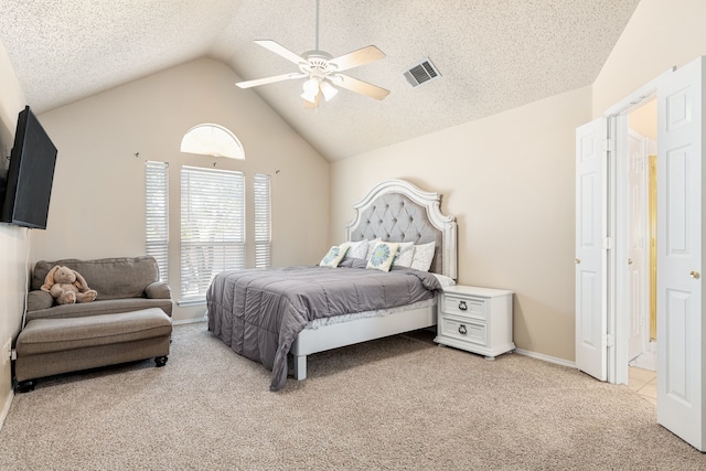 carpeted bedroom with a textured ceiling, ceiling fan, and lofted ceiling