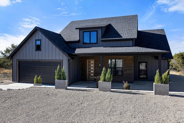 view of front facade with a porch and a garage