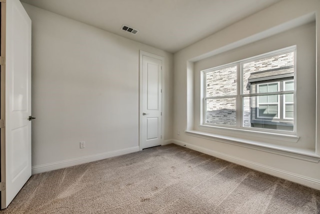 empty room featuring carpet flooring