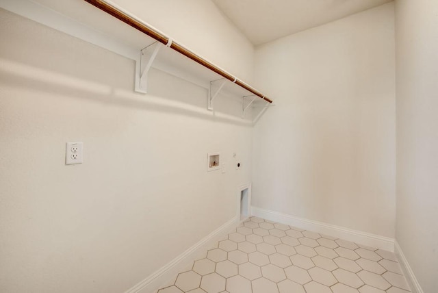 clothes washing area with hookup for a gas dryer, washer hookup, and hookup for an electric dryer