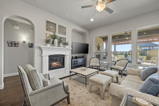 living room with hardwood / wood-style flooring and ceiling fan