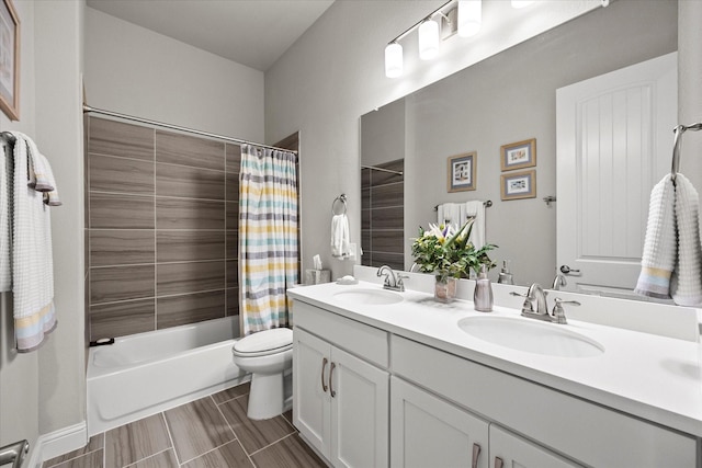 full bathroom featuring shower / tub combo, vanity, and toilet