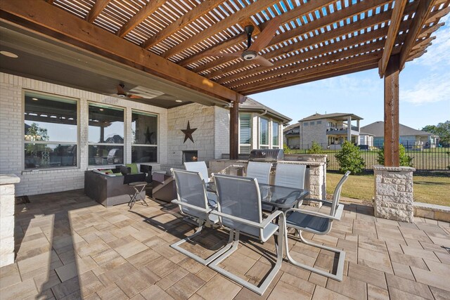 view of patio / terrace with a pergola and ceiling fan