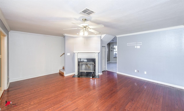 unfurnished living room featuring hardwood / wood-style flooring and crown molding