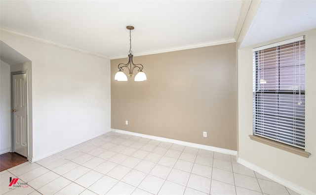 tiled empty room featuring a chandelier and crown molding