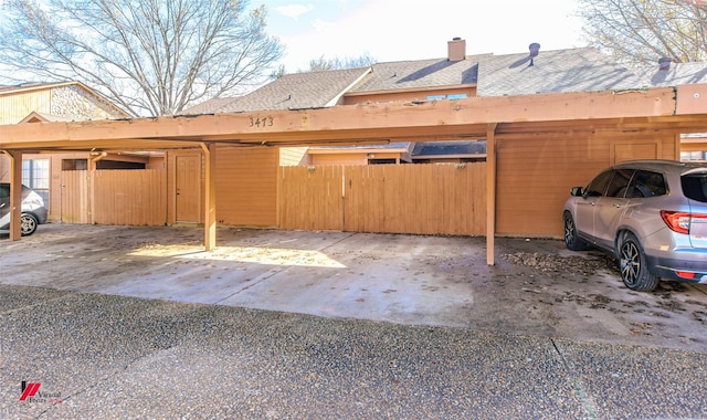 view of parking with a carport