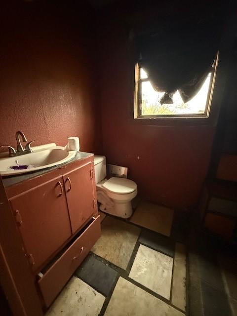 bathroom with vanity and toilet