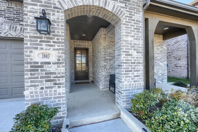 entrance to property featuring a garage