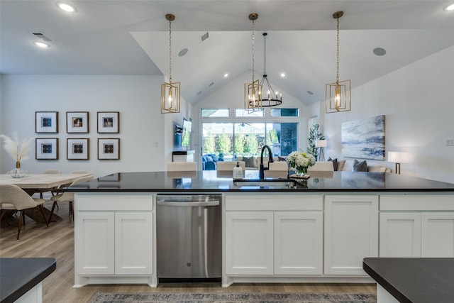 kitchen with pendant lighting, dishwasher, white cabinets, sink, and light hardwood / wood-style flooring