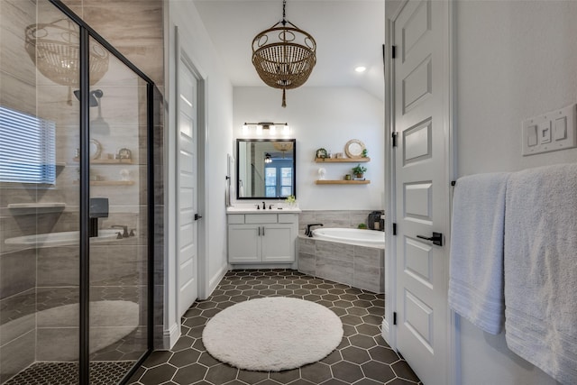 bathroom featuring tile patterned floors, vanity, plenty of natural light, and plus walk in shower