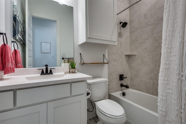 full bathroom with vanity, tiled shower / bath combo, and toilet