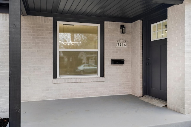 property entrance featuring covered porch