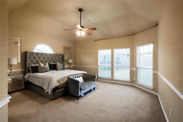 carpeted bedroom with lofted ceiling and ceiling fan