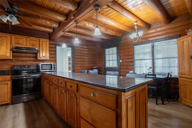 kitchen with log walls, electric range, hanging light fixtures, and dark stone countertops