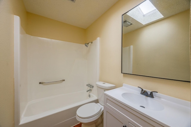 full bathroom with shower / washtub combination, toilet, a skylight, and vanity