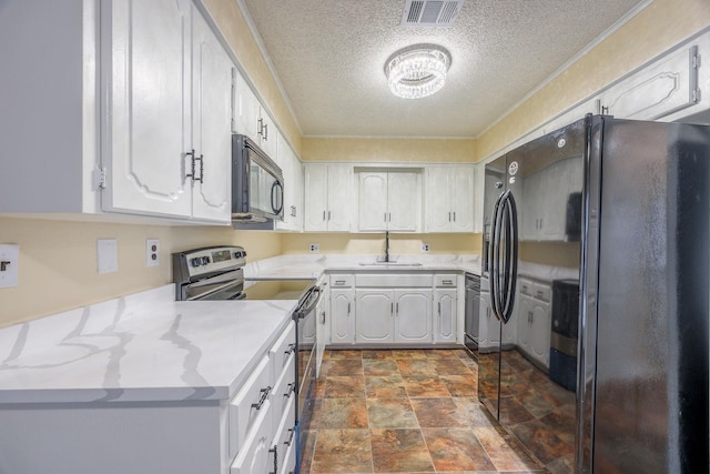 kitchen featuring white cabinetry, sink, a textured ceiling, and black appliances