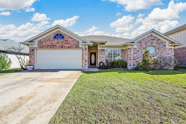 view of front of home with a garage and a front yard