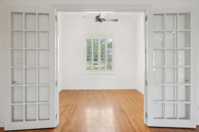 unfurnished room featuring light hardwood / wood-style flooring and ceiling fan