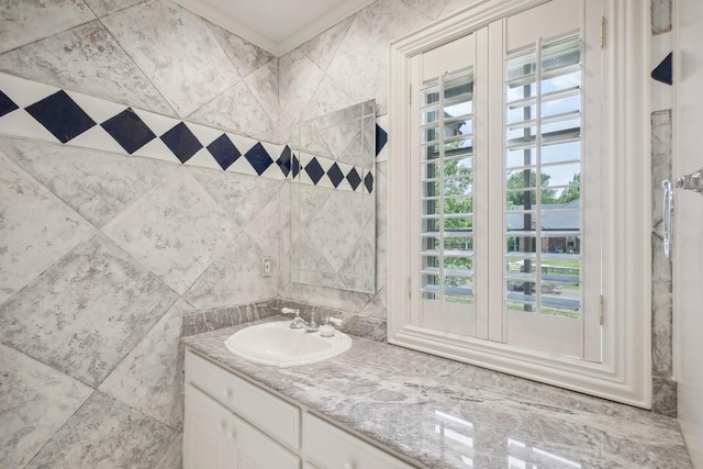 bathroom featuring plenty of natural light and vanity