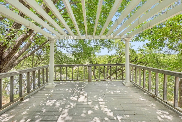 wooden deck featuring a pergola