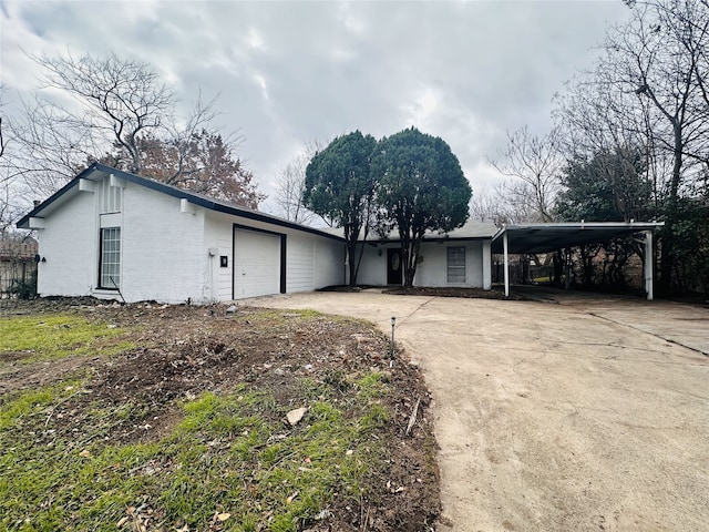 view of side of home featuring a garage