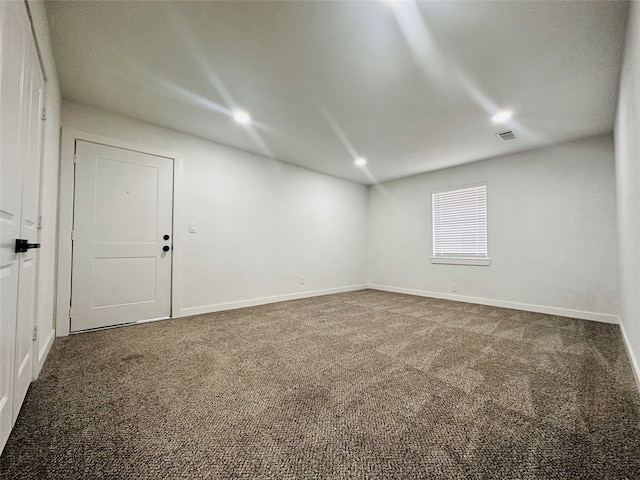 unfurnished room featuring carpet