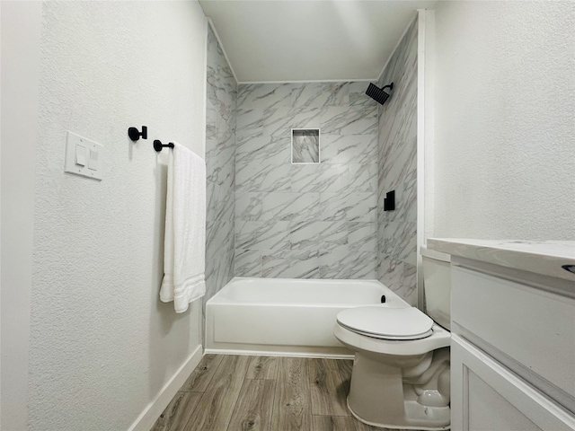 full bathroom with vanity, toilet, and tiled shower / bath combo