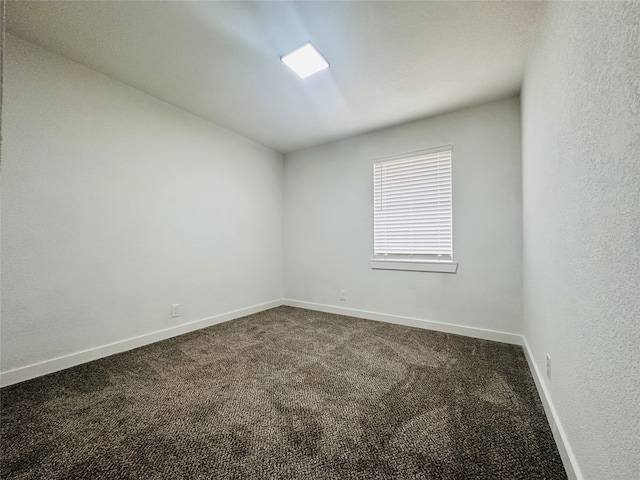 spare room featuring carpet