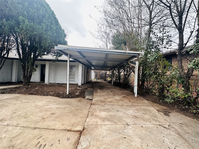 view of side of property featuring a carport