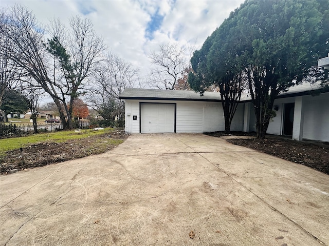 view of side of home featuring a garage