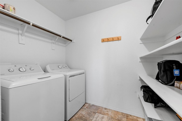 clothes washing area featuring washer and dryer