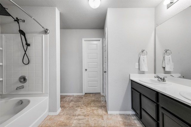 bathroom featuring shower / bathtub combination and vanity