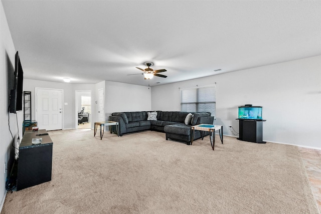 living room featuring ceiling fan and carpet flooring