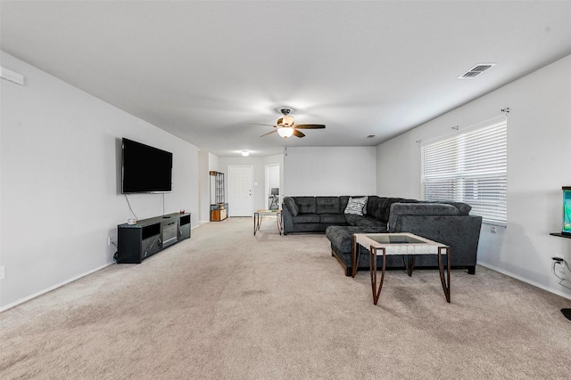 living room featuring ceiling fan and light colored carpet