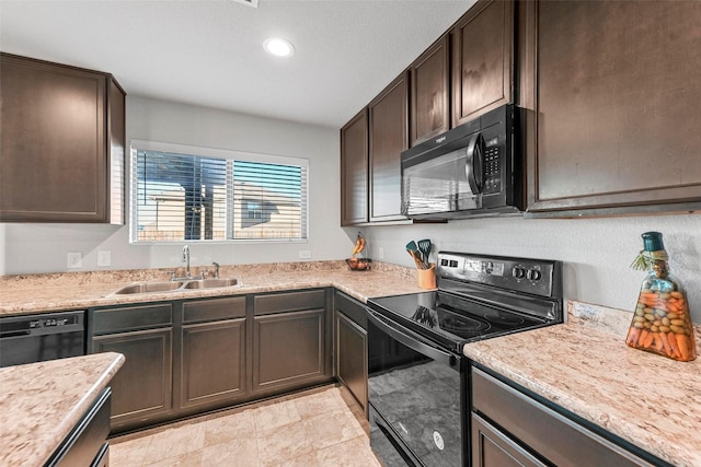 kitchen featuring sink, black appliances, and dark brown cabinetry