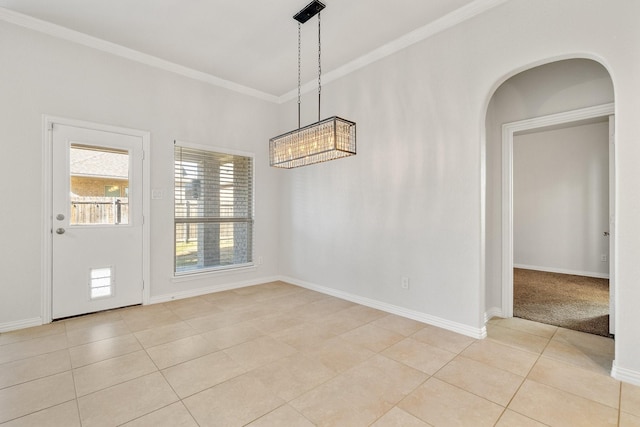 unfurnished dining area featuring crown molding and light tile patterned floors