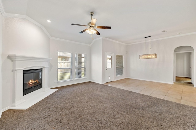 unfurnished living room with crown molding, light colored carpet, and ceiling fan