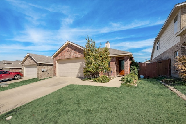 view of front of home with a garage and a front lawn