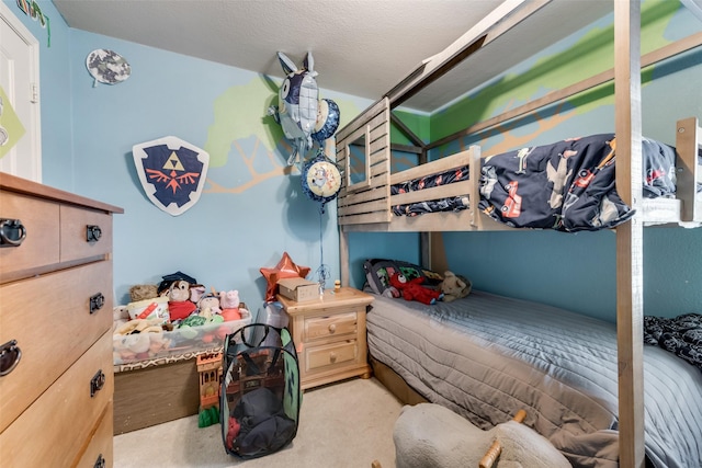 bedroom with light colored carpet and a textured ceiling