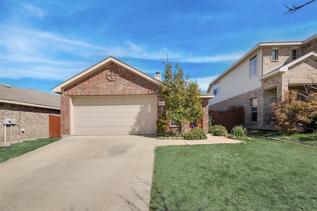 view of front of property featuring a garage and a front lawn