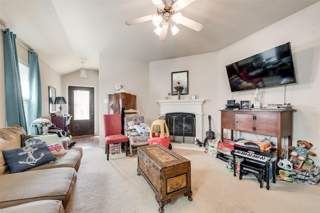 carpeted living room featuring ceiling fan and lofted ceiling