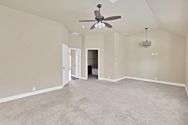 unfurnished room featuring vaulted ceiling, carpet floors, and ceiling fan