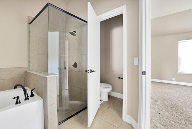 bathroom featuring tile patterned floors, independent shower and bath, and toilet