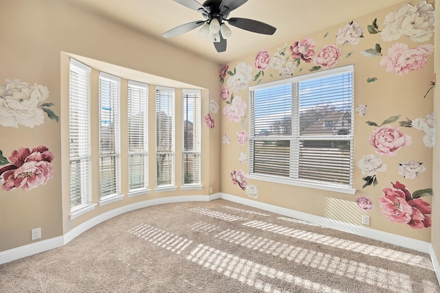 interior space featuring ceiling fan and carpet flooring